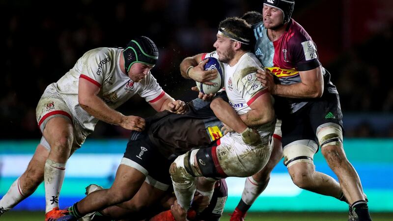 Sean Reidy is tackled by Stephan Lewies of Harlequins. Photo: Billy Stickland/Inpho