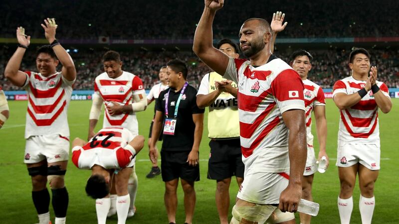 Michael Leitch celebrates Japan’s win over Ireland. Photograph: Cameron Spencer/Getty