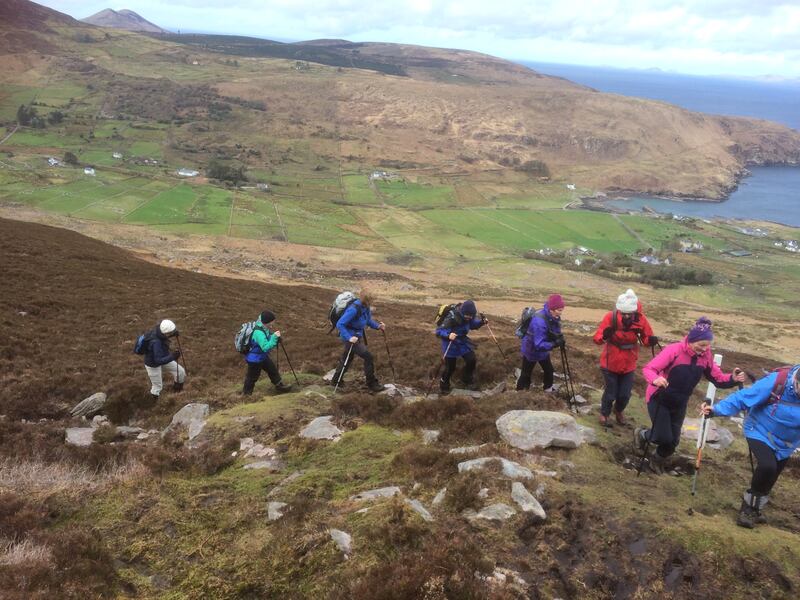 Walkers on the Cnoc na dTobar pilgrim path in Co Kerry