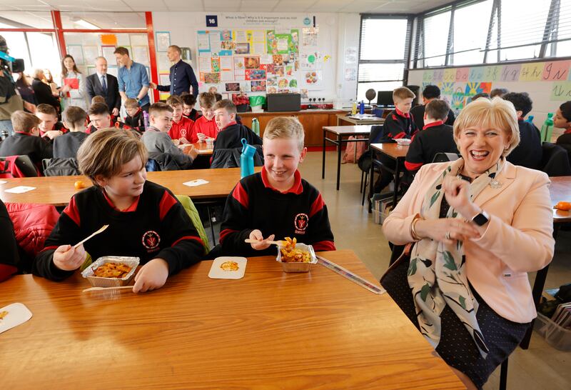 Heather Humphreys with students Oliver Butler and Dylan Byrne of St David’s National School in Artane, Dublin, announcing the expansion of the school meals scheme in March 2023.  Photograph: Alan Betson/The Irish Times

