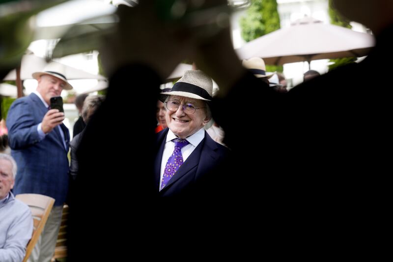 President Michael D Higgins enjoys the entertainment at the Bloomsday garden party in Áras an Uachtaráin. Photograph: Maxwell’s