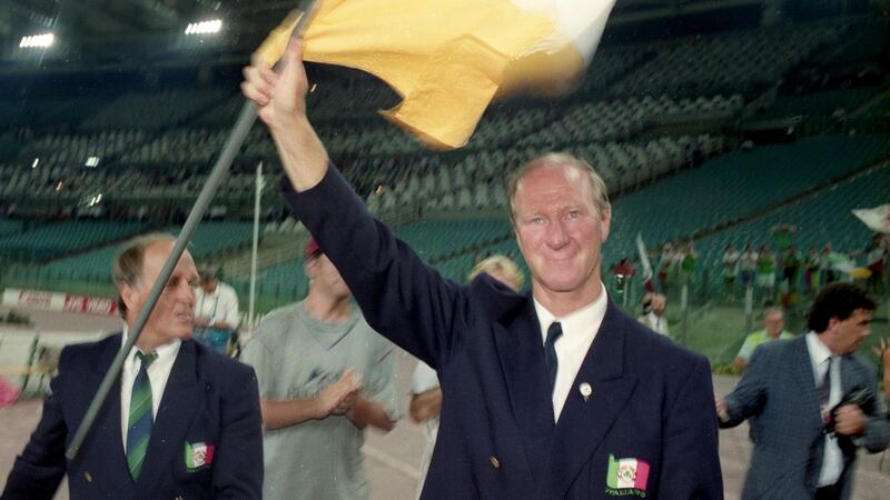 Jack Charlton and assistant Maurice Setters salute the Ireland fans at the Olympic Stadium in Rome after the World Cup quarter-final against Italy. Photograph: Billy Stickland/Inpho