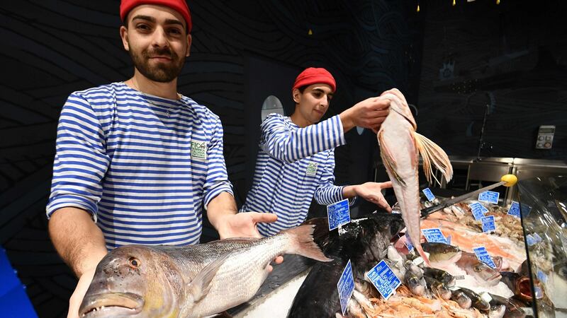 Fishmongers at Fico Eataly World in Bologna, Italy, said to be the world’s biggest agri-food park at 10 hectares in area. Photograph: Vincenzo Pinto/AFP/Getty Images
