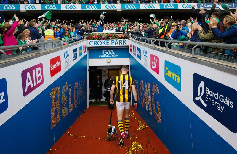 Kilkenny’s TJ Reid leaves the field dejected as Limerick manager John Kiely celebrates with the Liam MacCarthy Cup. Photograph: James Crombie/Inpho