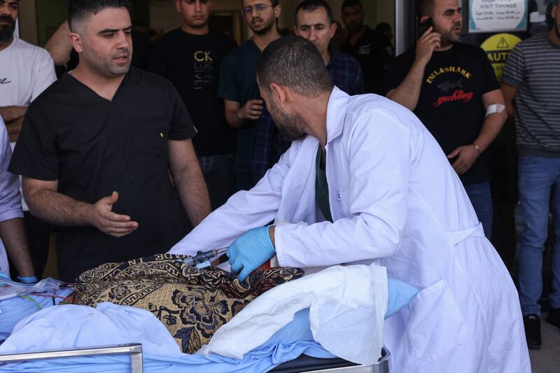 Palestinian medics transport an injured person into a hospital during the Israeli military operation in Jenin city in the occupied West Bank on Monday. Photograph: Ronaldo Schemidt/AFP via Getty Images