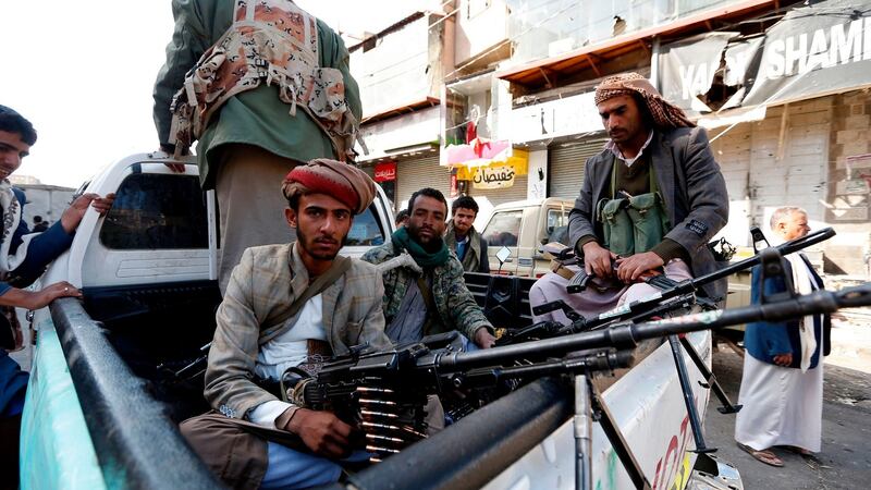 Houthi rebel fighters   in front of the residence of Yemen’s former president, Ali Abdullah Saleh,  in Sana’a after he was killed on Monday. Photograph: Mohammed Huwais/AFP/Getty Images