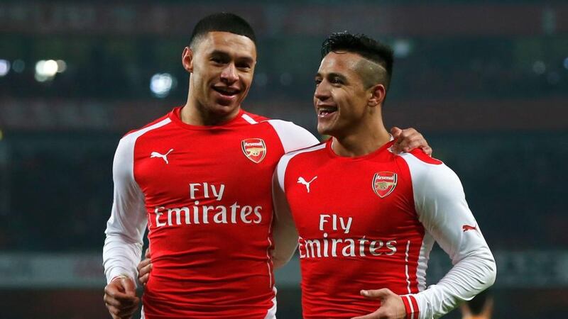 Alexis Sanchez (right) of Arsenal celebrates with team mate Alex Oxlade-Chamberlain after scoring his team’s second goal against Hull   at the Emirates Stadium. Photograph: Suzanne Plunkett / Reuters
