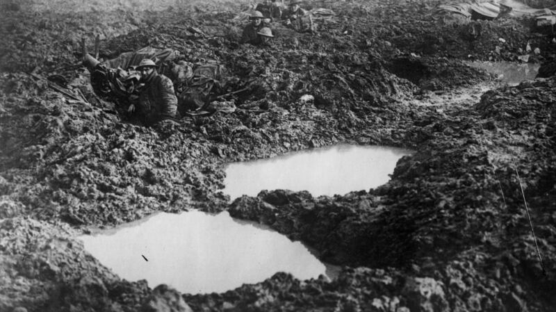 Soldiers of the 16th Canadian machine gun regiment using shell holes as makeshift defences at Passchendaele Ridge. Photograph: William Rider-Rider/Getty Images