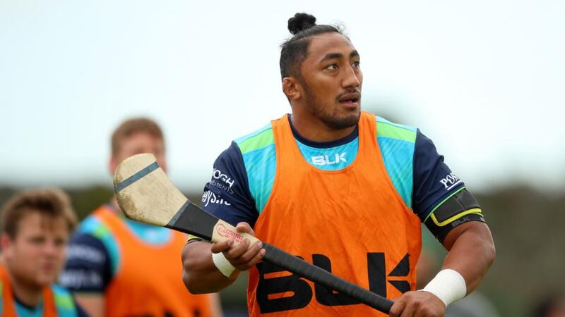 Bundee Aki plays a bit of hurling at Connacht training in the Sportsground, Galway. Photograph: James Crombie/Inpho
