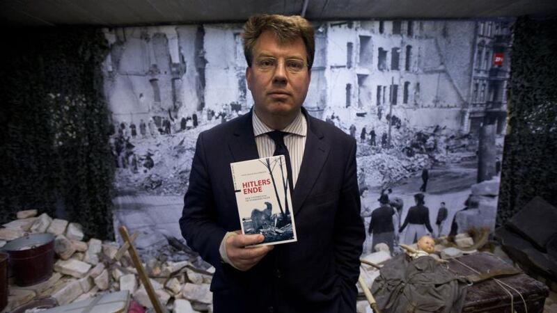 German historian Sven Felix Kellerhoff with his book about the Führerbunker: “The tourists are attracted by the creepiness factor, which is understandable emotionally, but I still say it’s better that they come than not at all.” Photograph: John MacDougall/AFP/Getty Images