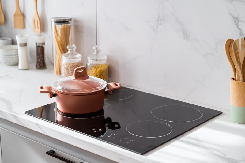 Induction hobs are ideal for small kitchens. Photograph: iStock