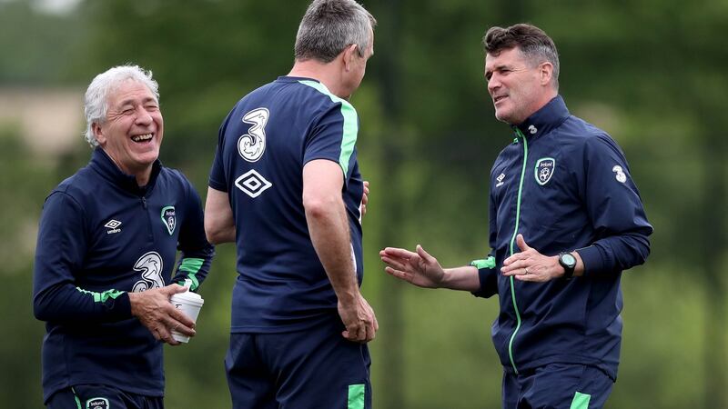 Kitman Mick Byrne shares a joke with assistant manager Roy Keane  and physio Michael Spillane at training. Photograph: Ryan Byrne/Inpho