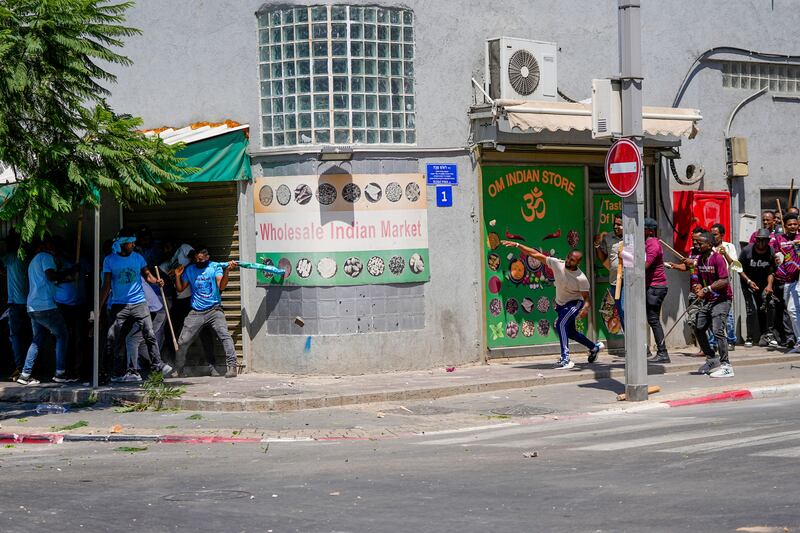 Israeli police said 27 officers were injured in the clashes, and at least three protesters were shot when police opened fire with live rounds. Many of the anti-government protesters wore sky blue shirts, while government supporters wore purple shirts. Photograph: Ohad Zwigenberg/AP