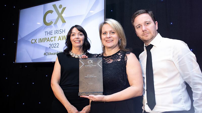 Jenny McCoy, awards judge, presents the CX Impact in Professional Services award to Sinead Doherty & Keith Finney, Fenero.