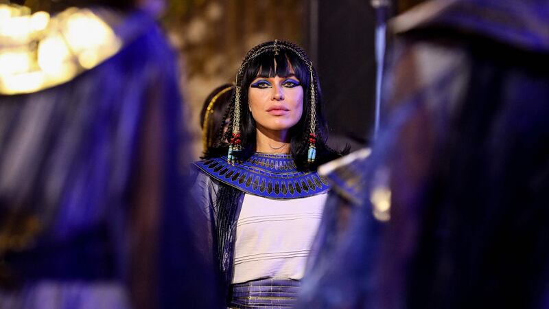 A performer dressed in ancient Egyptian costume awaits  the start of the parade of ancient Egyptian royal mummies departing from the Egyptian Museum in Cairo’s Tahrir Square. Photograph: Getty