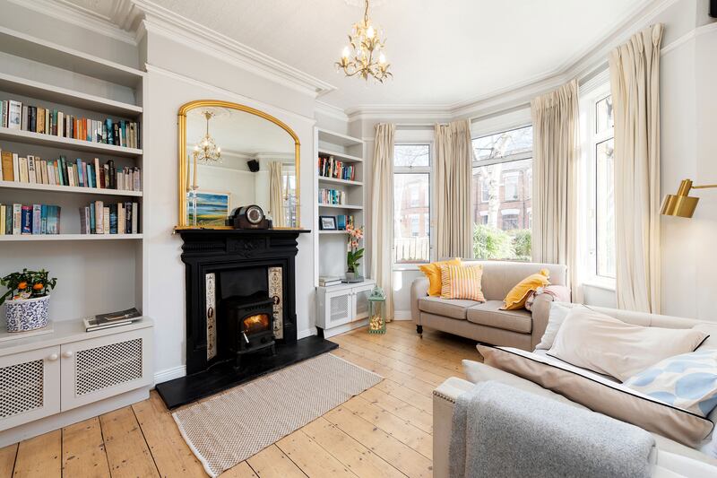 Some of the family’s vast collection of books are stored within new built-in units in the front drawingroom overlooking the front garden.
