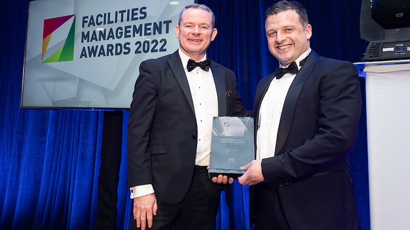 Liam Smith, Sales Director, Tork, presents the Overall Excellence in Facilities Management Award to Mark Cullen, Sensori FM.