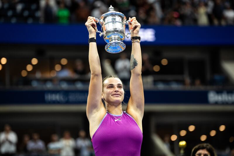 Aryna Sabalenka holds up the championship trophy after victory over Jessica Pegula in US Open final. Photograph: Graham Dickie/The New York Times
                      