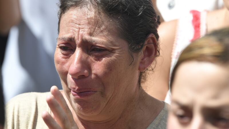 A relative of Emiliano Sala cries after a vigil at Sala’s boyhood club in Progreso, Argentina. Photograph: Gustavo Garello/Getty Images
