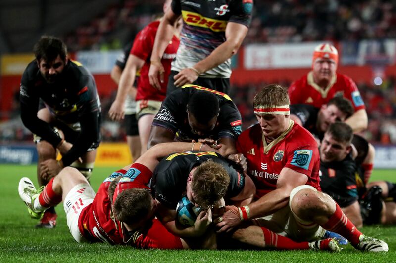 Stormers' Evan Roos is held up over the line by Jack Crowley and Gavin Coombes of Munster during the BKT United Rugby Championship match at Thomond Park. Photograph: Ben Brady/Inpho 