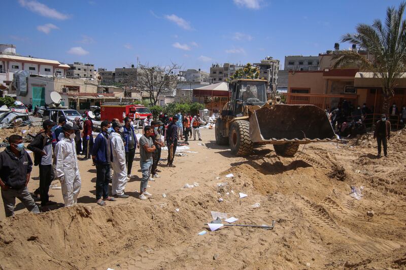 Palestinian health workers prepare to recover bodies from a mass grave at the Nasser Medical Hospital compound in Khan Younis on Sunday. Photograph: Ahmad Salem/Bloomberg