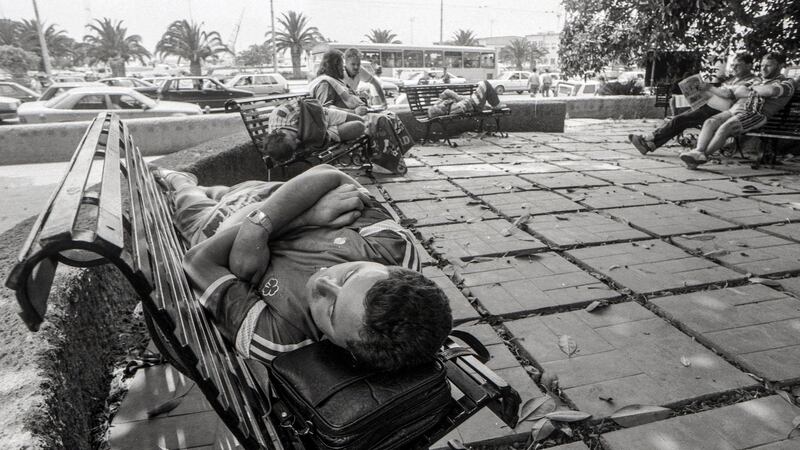 Ireland fans sleep on benches in Cagliari before the game against England. Photo: James Meehan/Inpho