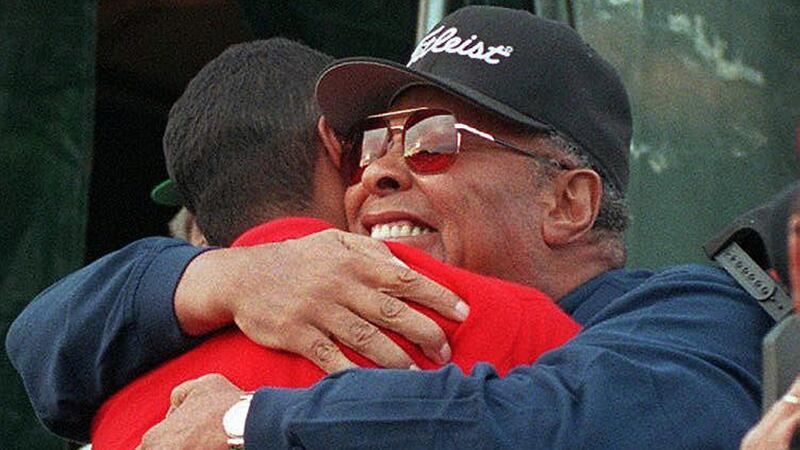 Earl Woods hugs his son after his record brekaing win. Photo: Bob Pearson/Getty Images