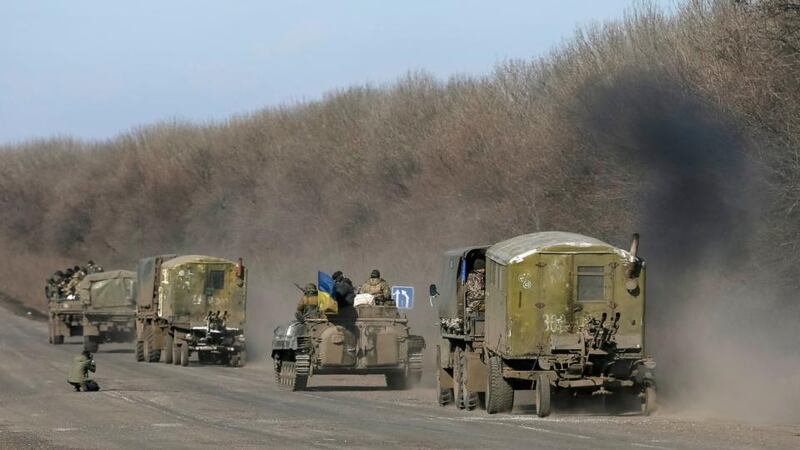 Members of the Ukrainian armed forces ride military vehicles near Artemivsk, eastern Ukraine on Monday. Photograph: Gleb Garanich/Reuters.