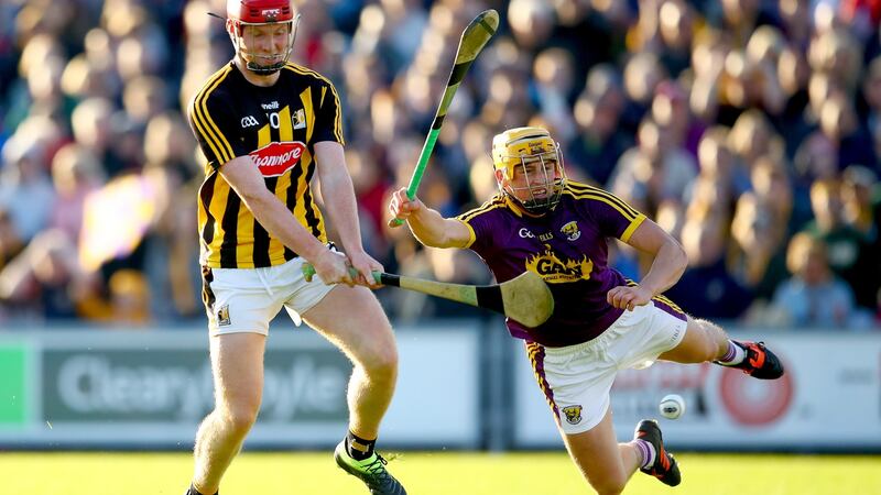 Kilkenny’s Adrian Mullen scores his side’s opening goal despite the attempt of Damien Reck of Wexford to block his shot during the Leinster SHC round-robin game at Wexford Park. Photograph: James Crombie/Inpho