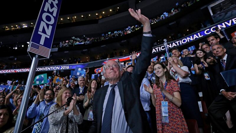 Senator from Vermont and former US presidential candidate Bernie Sanders moves to nominate Hillary Clinton by voice vote and waves to the delegates. Photograph: Peter Foley/EPA