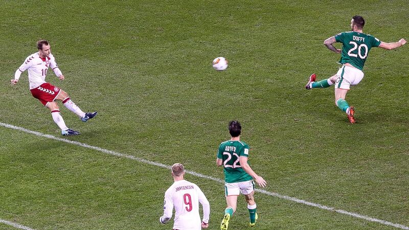 Denmark’s Christian Eriksen scores his side’s second goal. Photograph: Gary Carr/Inpho