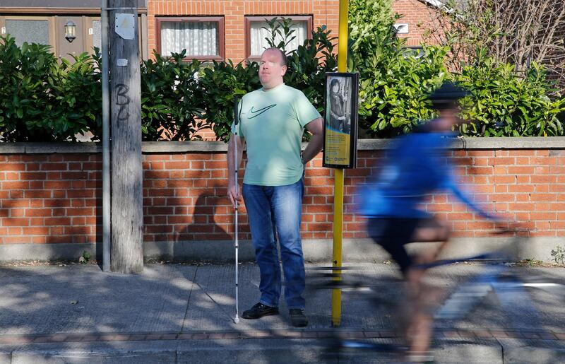 DISCONNECTS? Tony Murray, who is blind, waits at a bus stop on Collins Avenue, Dublin. Under the BusConnects plan, he will have to walk further from his home to a different bus stop, and he has expressed major concerns over this. Photograph: Nick Bradshaw/The Irish Times