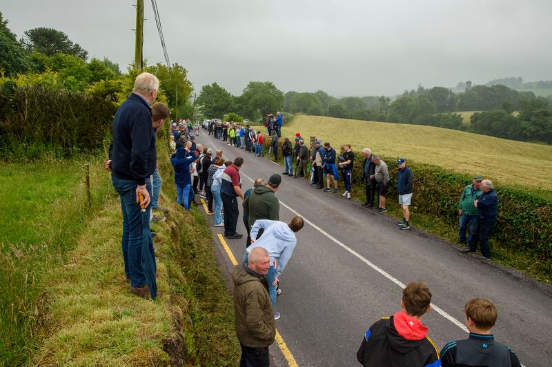 Crowds line the road in Castletownkinneigh, west Cork, for the Junior B Munster Road Bowling final. Photograph: Daragh Mc Sweeney/Provision