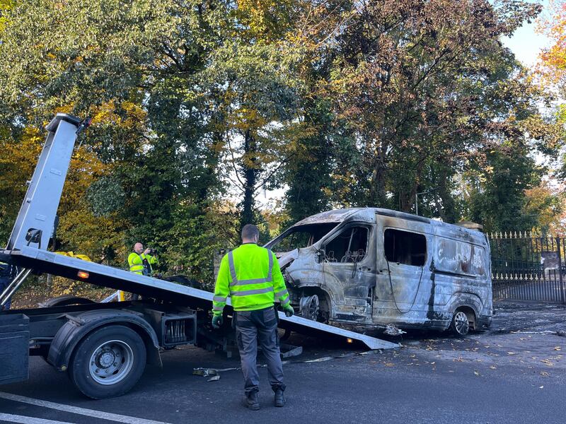 A van set on fire by protesters at Citywest hotel on Tuesday night is removed from the scene on Wednesday morning. Photograph: Sarah Burns