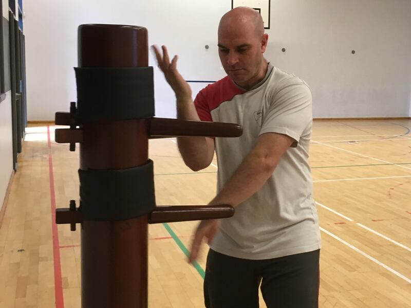 Daragh using the Wooden Dummy.