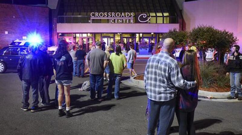 A group gathered near the entrance of the Crossroads Center mall after reports a stabbing attack in St. Cloud, Minnesota on Saturday. Photograph: Dave Schwarz/St. Cloud Times, via Associated Press