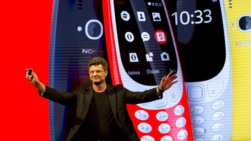 Arto Nummela, chief executive officer at HMD Global, with the re-launched Nokia 3310 phone. It is an upgrade on the original with a larger colour screen, micro-USB charging and a camera. Photograph: Emilio Morenatti/AP Photo
