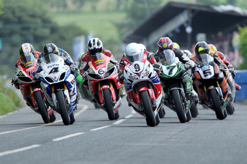 William (6) and Michael Dunlop (9) lead the Superbike pack off the start line during the 2013 Ulster Grand Prix. Photograph: Stephen Davison
