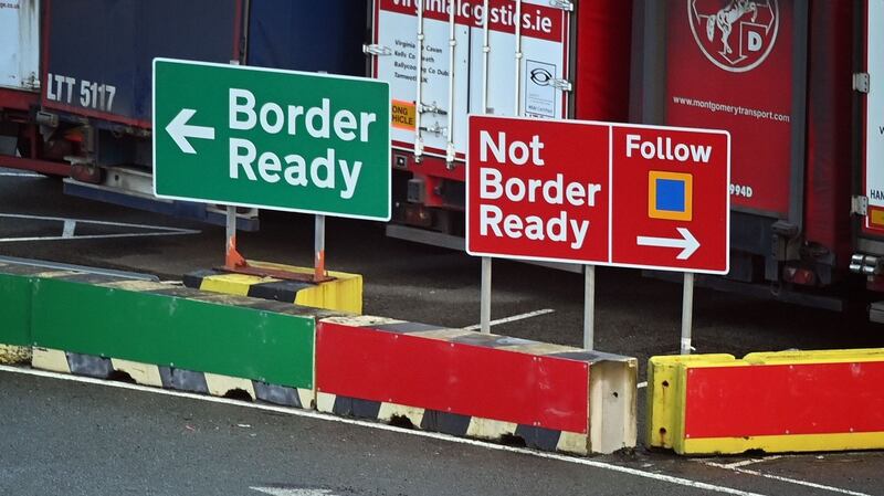 Signage indicates the direction vehicles should follow depending on the relevant paperwork for crossing to Ireland at the check-in area at Holyhead port in Anglesey, north Wales. Photograph: Paul Ellis / AFP