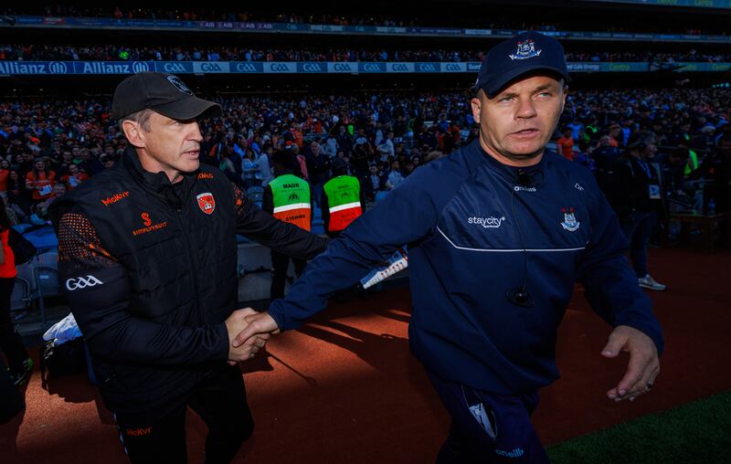Armagh manager Kieran McGeeney (left) shakes hands with Dublin counterpart Dessie Farrell  after the game. Photograph: James Crombie/Inpho