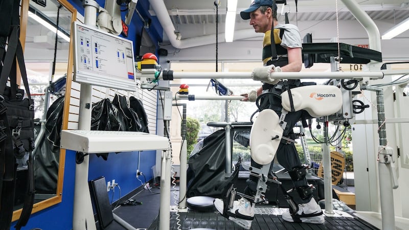 Kevin Babington uses a machine to help him simulate walking during a therapy session at the Center for Neuro Recovery in North Palm Beach, Florida. Photograph: Bryan Cereijo/NYT