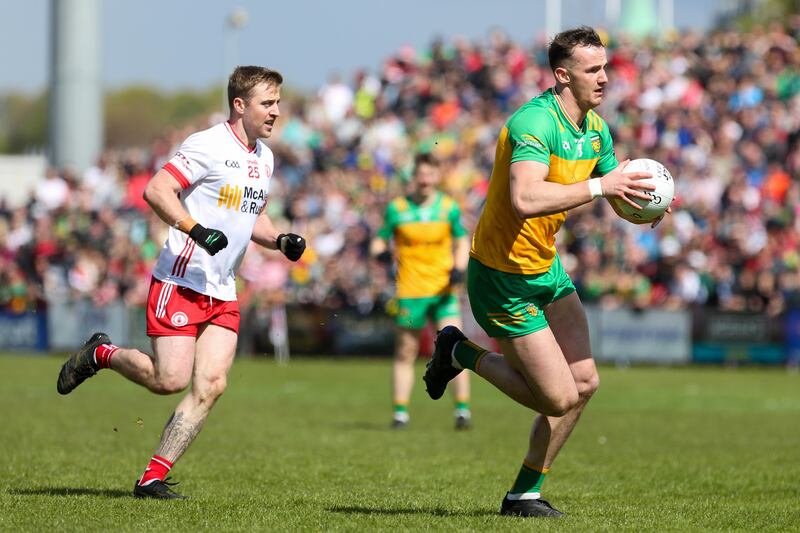 Donegal's Jason McGee and Tyrone's Michael O'Neill in Ulster GAA Senior Football Championship Semi-Final in Celtic Park. Photograph: Lorcan Doherty/Inpho