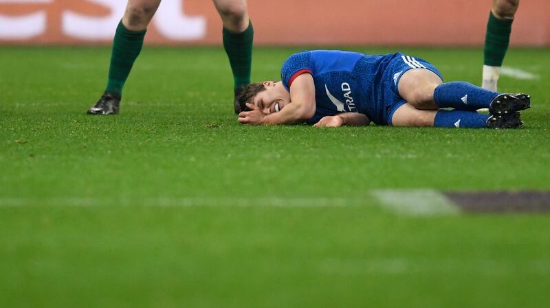 France’s Antoine Dupont lies injured towards the end of Ireland’s win in Paris. Photograph: Christophe Simon/AFP
