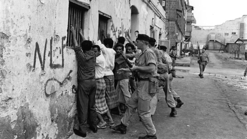 4th April 1967:  Soldiers of the Northumberland Fusilier regiment force Arab demonstrators against a wall during nationalist terrorist attacks aiming to expel British forces from South Arabia. Aden became the capital of the People's Republic of Southern Yemen in 1967.  (Photo by Terry Fincher/Express/Getty Images)