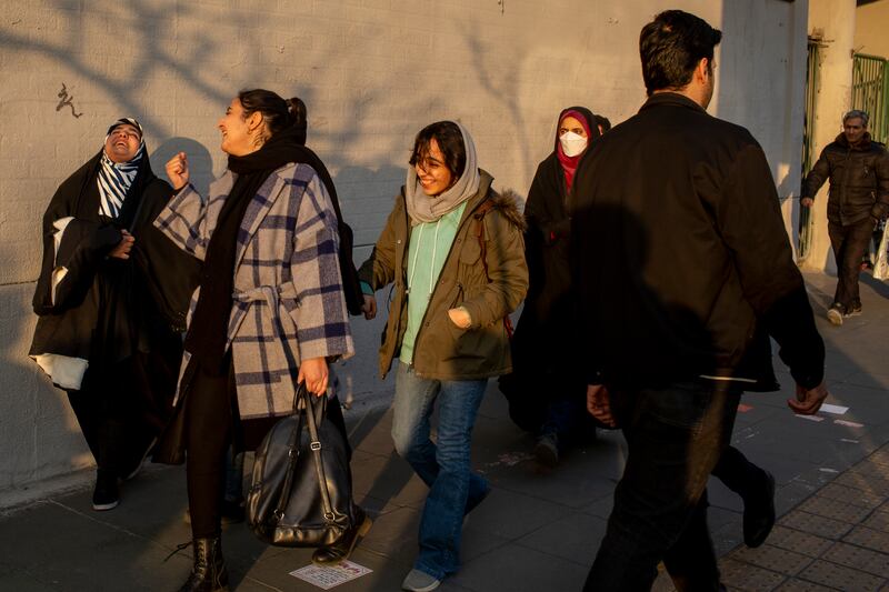Women with varying degrees of head coverings on the street in Tehran. Photograph: Arash Khamooshi/The New York Times