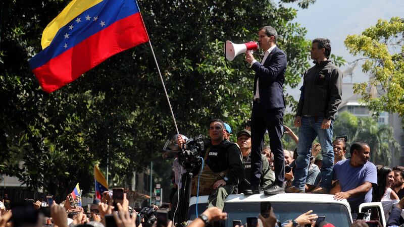 Juan Guiadó (left on van) and Leopoldo Lopez (right) at a protest in Caracas. Photograph: Miguel Gutierrez/EPA