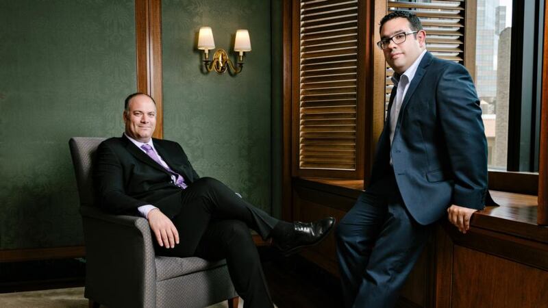 David Watson, left, a MD at Deutsche Bank, and Fernando Hernandez, an engineer at the bank who has mentored him. Photograph: Axel Dupeux/The New York Times