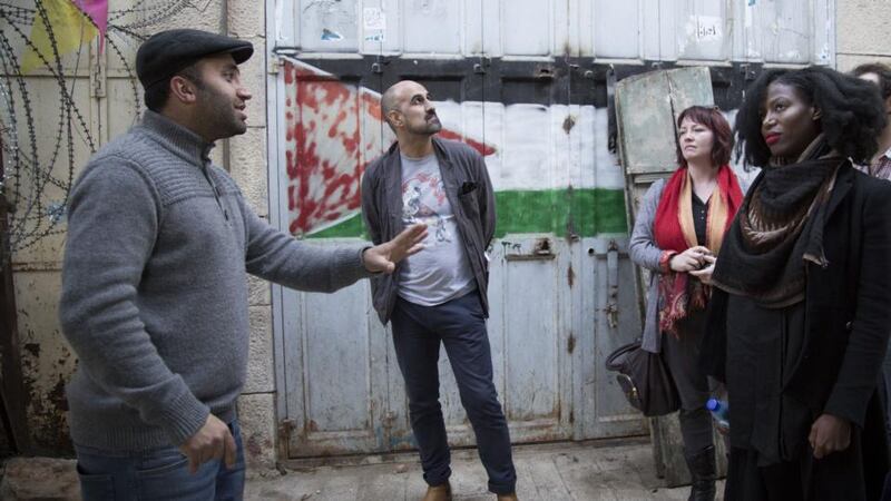 Observing the occupation: community organiser Issa Amro with Eimear McBride and her fellow writers Hari Kunzru and Taiye Selasi. Photograph: Oren Ziv/Active Stills