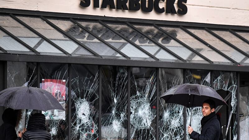 Graffiti and a broken window following a series of protests by the Gilet Jaunes. Photograph: Jeff J Mitchell/ Getty Images