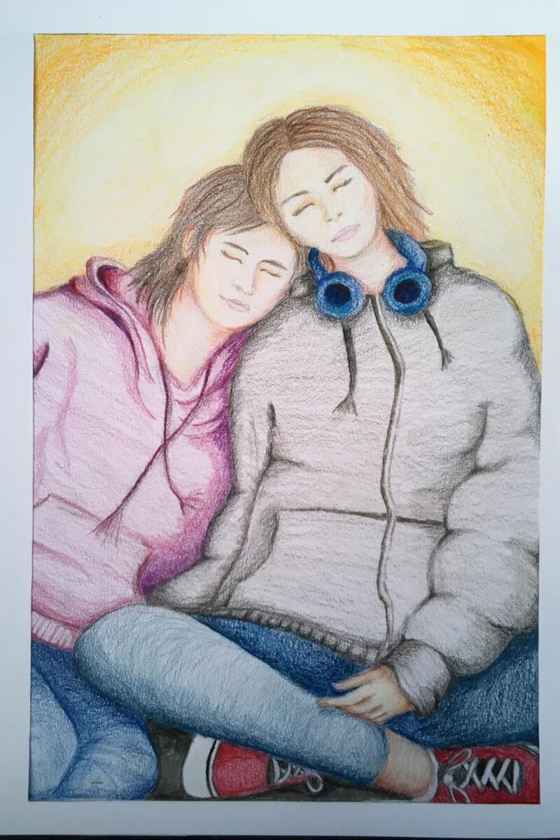 Picture by  Abaigh Roarty (13): I got inspiration to create this drawing because during this quarantine it has taught me to appreciate the people around us. The drawing is inspired by a photo of myself and my sister after coming out of the cinema, one of our favourite things to do together. My sister Clara has a learning disability called Angelman syndrome, she also can’t speak. She’s had to get used to us not going out to the cinema, restaurants and school, but is coping well with that. During isolation it has given me a chance to spend more time with my parents. But sadly, my mother has been tested positive for COVID19 so she has to self isolate for 14 days, we’re all getting used to that and it is quite lonely in the house without her.
